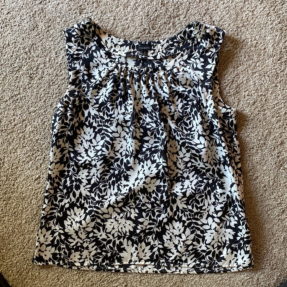 Beautiful black and white flowered top.  Well loved but in great condition.